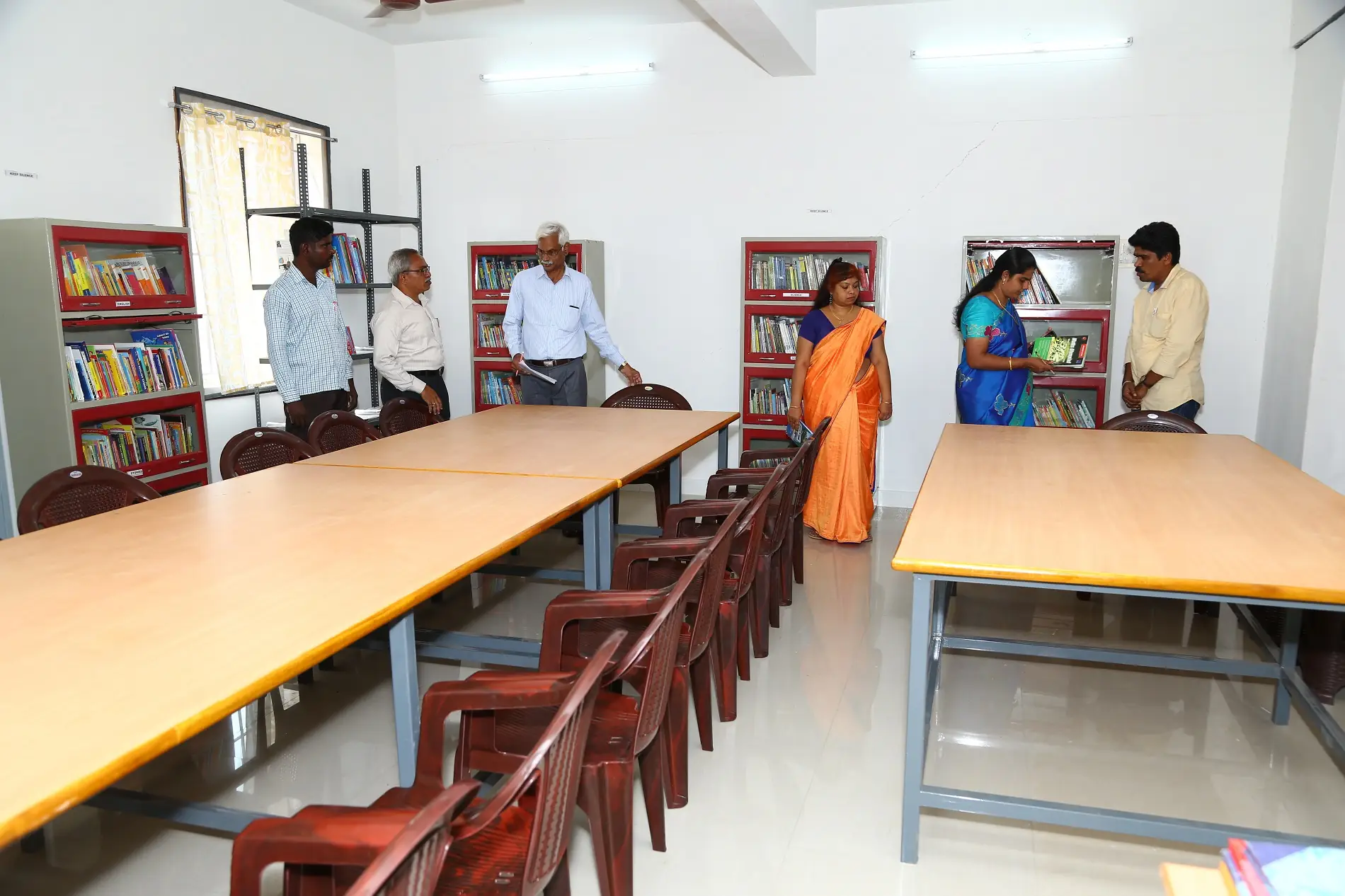 School library with reading tables and bookshelves
